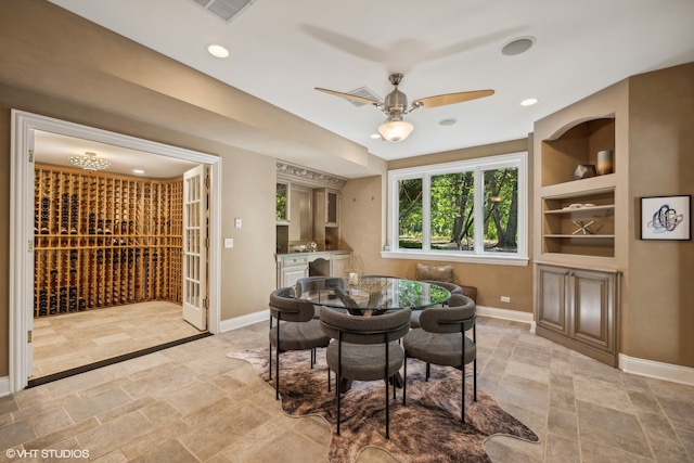 dining room featuring built in shelves and ceiling fan