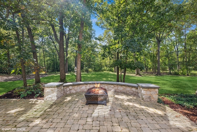 view of patio featuring an outdoor fire pit