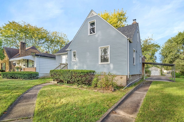 18018 Wentworth Ave, Lansing, IL 60438 - view of side of property featuring a lawn, an outbuilding, a chimney, and a shingled roof