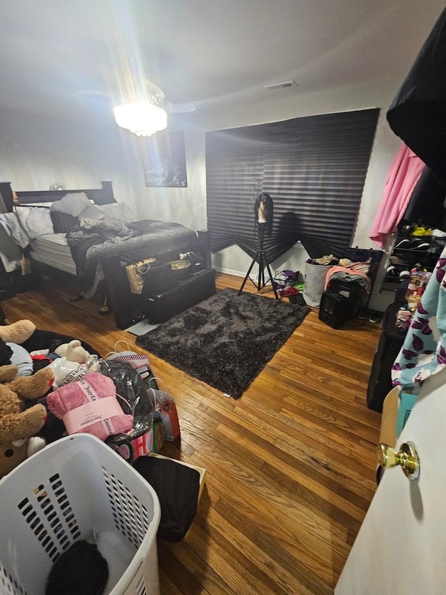 bedroom with wood-type flooring