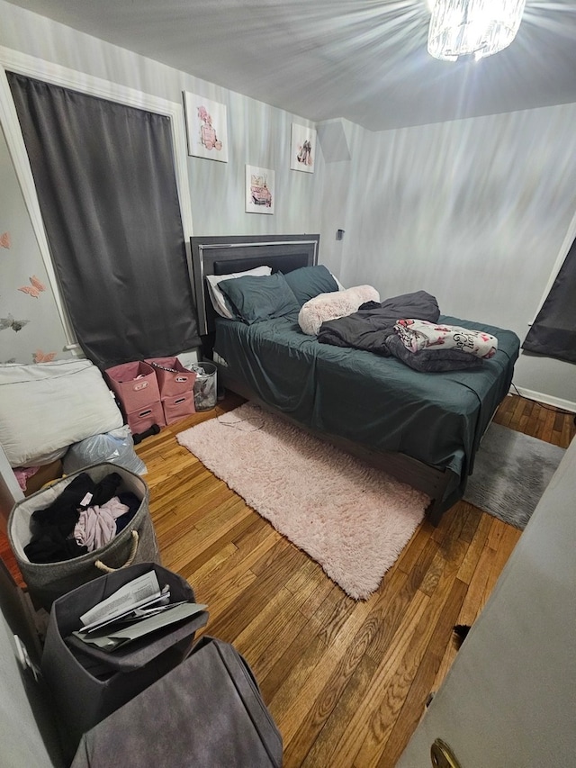 bedroom with wood-type flooring