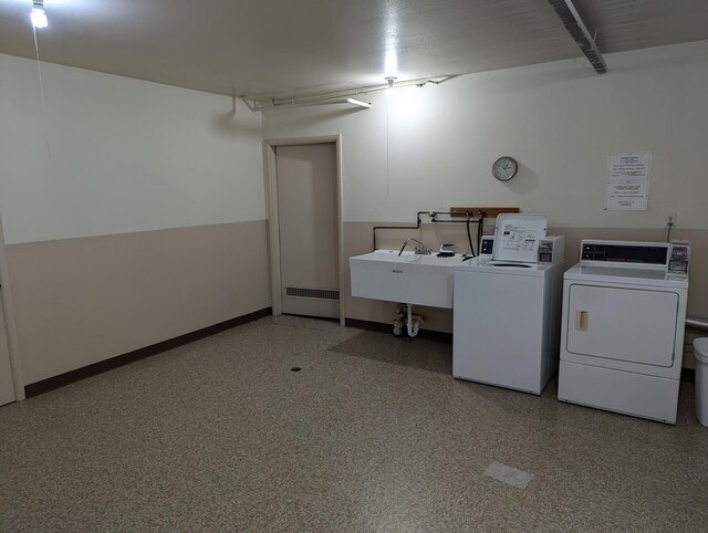 laundry area featuring sink and independent washer and dryer