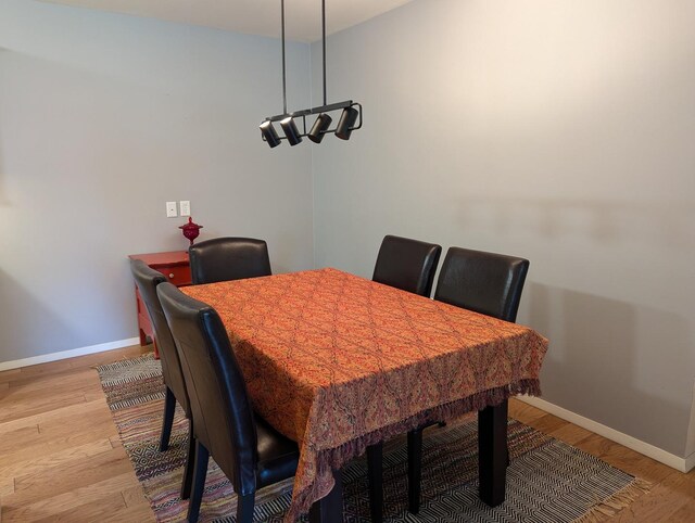 dining room with light wood-type flooring