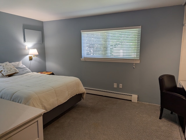 bedroom featuring baseboard heating and carpet flooring