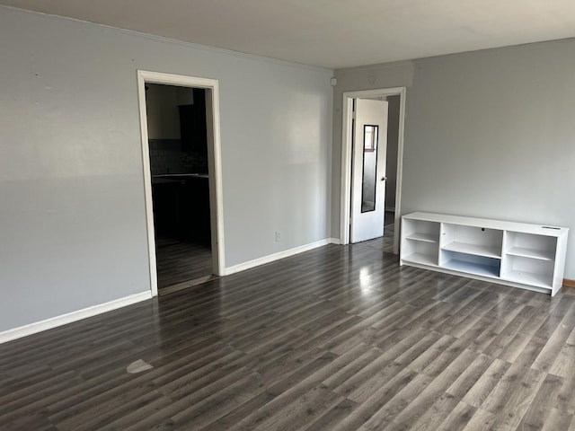 unfurnished room featuring dark hardwood / wood-style floors