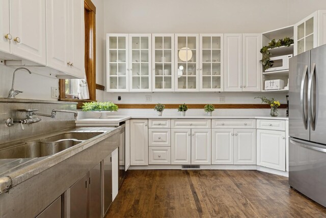 5235 S University Ave, Chicago, IL 60615 - kitchen with appliances with stainless steel finishes, white cabinets, dark wood-type flooring, open shelves, and a sink