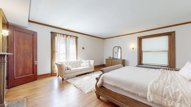 bedroom featuring radiator heating unit, light hardwood / wood-style flooring, and ornamental molding