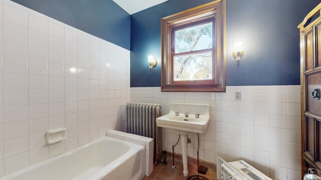 5235 S University Ave, Chicago, IL 60615 - full bathroom with radiator heating unit, a bath, tile walls, a wainscoted wall, and tile patterned flooring