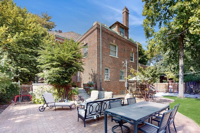 5235 S University Ave, Chicago, IL 60615 - view of patio featuring a gate and an outdoor hangout area