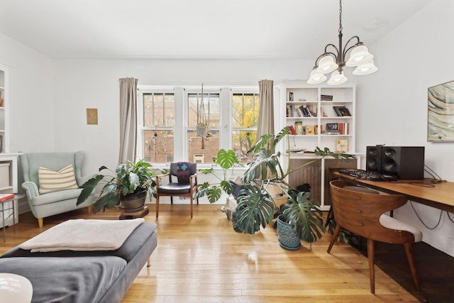 interior space featuring light wood-type flooring and a notable chandelier