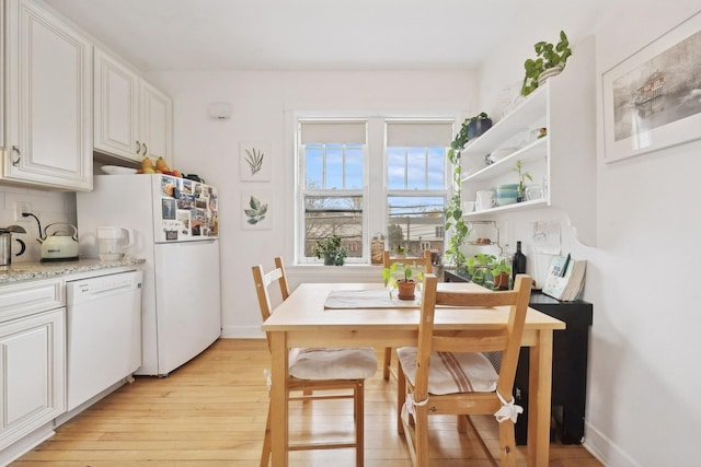 5235 S University Ave, Chicago, IL 60615 - dining room with light wood-type flooring and baseboards