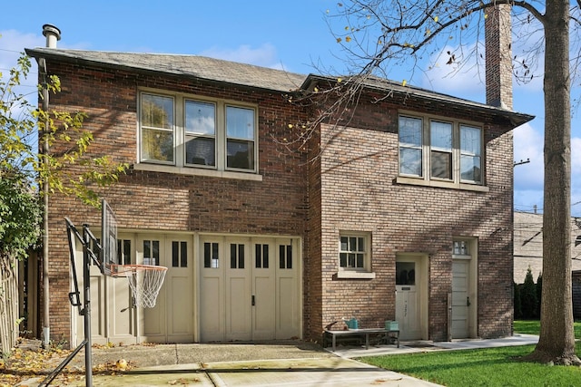 5235 S University Ave, Chicago, IL 60615 - view of front facade featuring brick siding and a chimney