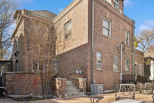 5235 S University Ave, Chicago, IL 60615 - view of side of property with brick siding and cooling unit
