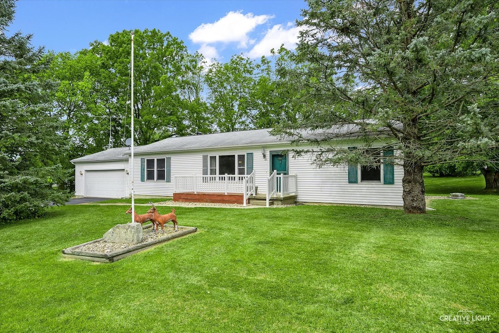 exterior space featuring a front lawn and a garage