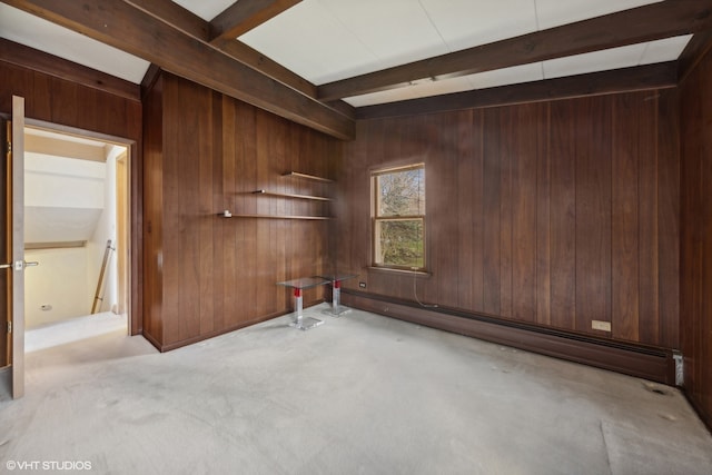 unfurnished room featuring light colored carpet, wood walls, and beam ceiling