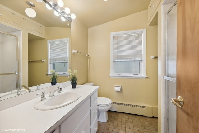 bathroom featuring vanity, vaulted ceiling, baseboard heating, tile patterned floors, and toilet