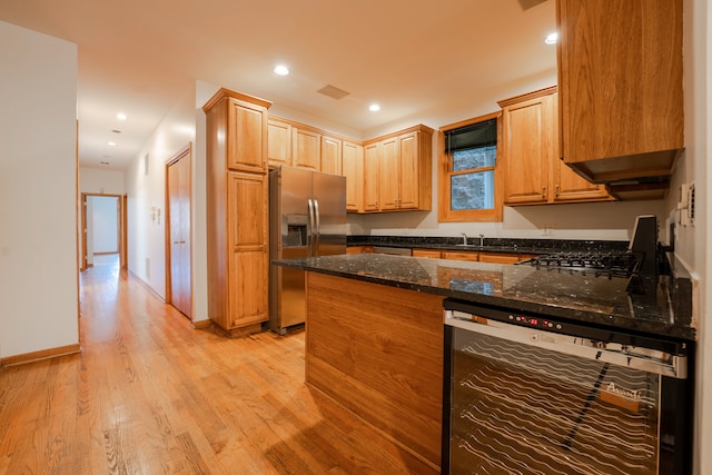 empty room featuring ceiling fan and hardwood / wood-style floors