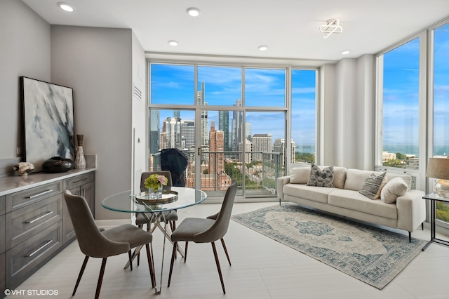 interior space featuring floor to ceiling windows and a water view