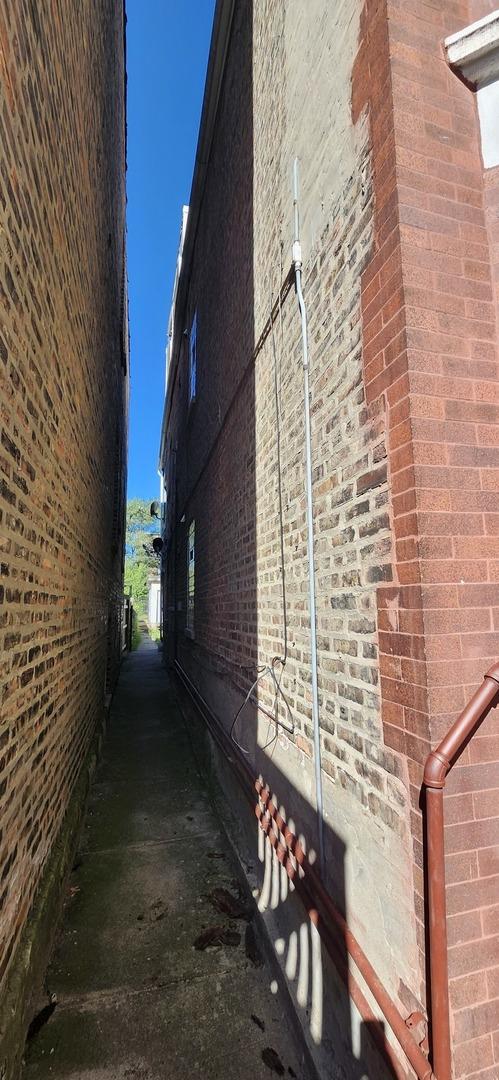 view of property exterior featuring brick siding