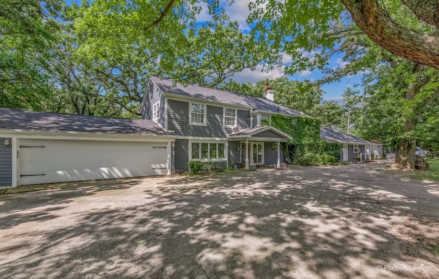 colonial home with a garage