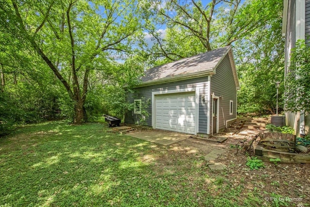 garage with a yard