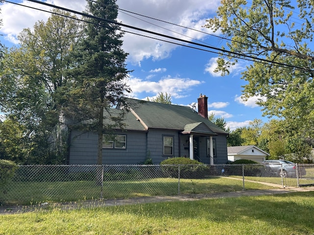 view of side of home with a lawn