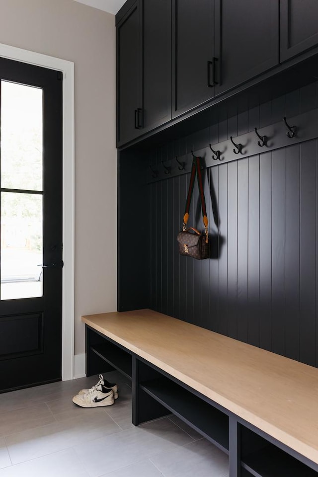 mudroom with light tile patterned floors