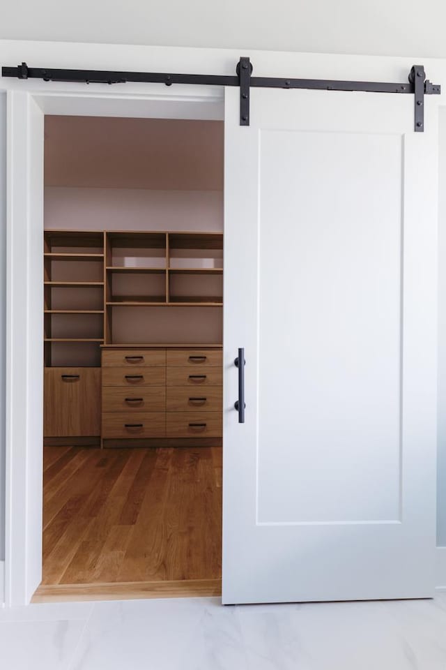 interior space featuring a barn door