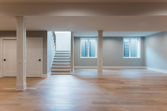 basement featuring plenty of natural light and light wood-type flooring