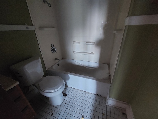 bathroom featuring tub / shower combination, tile patterned flooring, and toilet