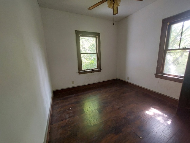 unfurnished room featuring ceiling fan and dark hardwood / wood-style floors