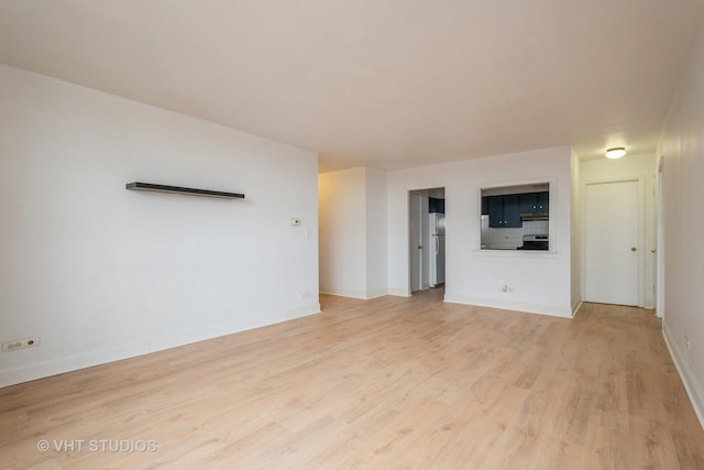 unfurnished living room with light hardwood / wood-style floors