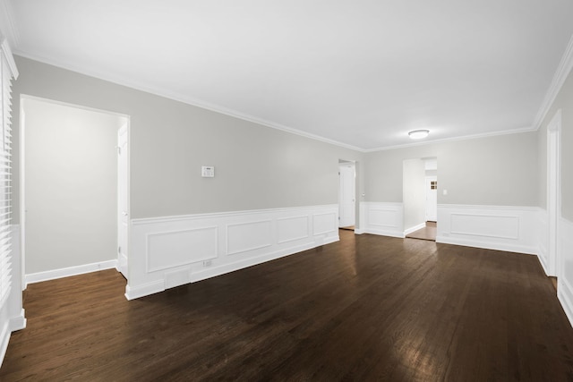 unfurnished living room with crown molding and dark wood-type flooring