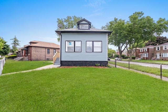 view of front facade featuring a front yard