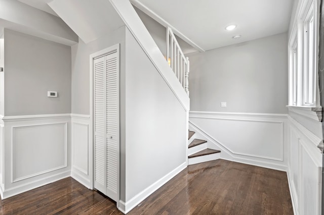 staircase with hardwood / wood-style floors