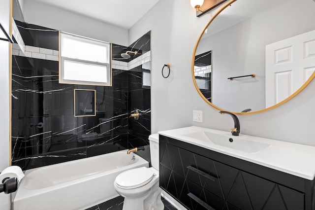 full bathroom featuring tile patterned flooring, tiled shower / bath, vanity, and toilet