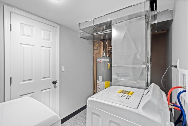 laundry area with gas water heater and washing machine and dryer