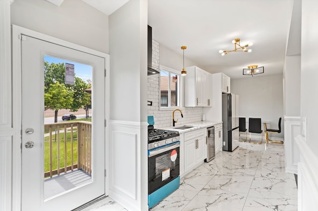 kitchen featuring white cabinets, wine cooler, appliances with stainless steel finishes, and a wealth of natural light