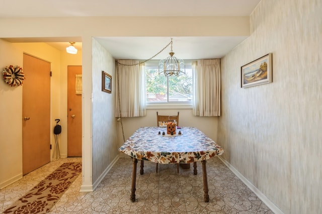 dining space with a notable chandelier