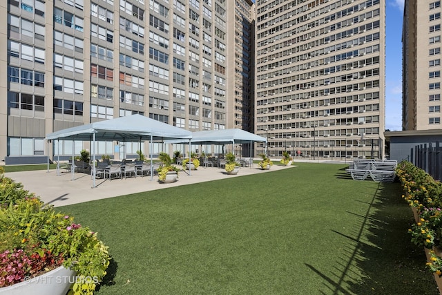 surrounding community featuring a gazebo, a yard, and a patio area