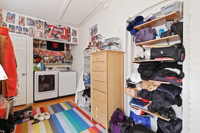 interior space with hardwood / wood-style flooring and washer and clothes dryer