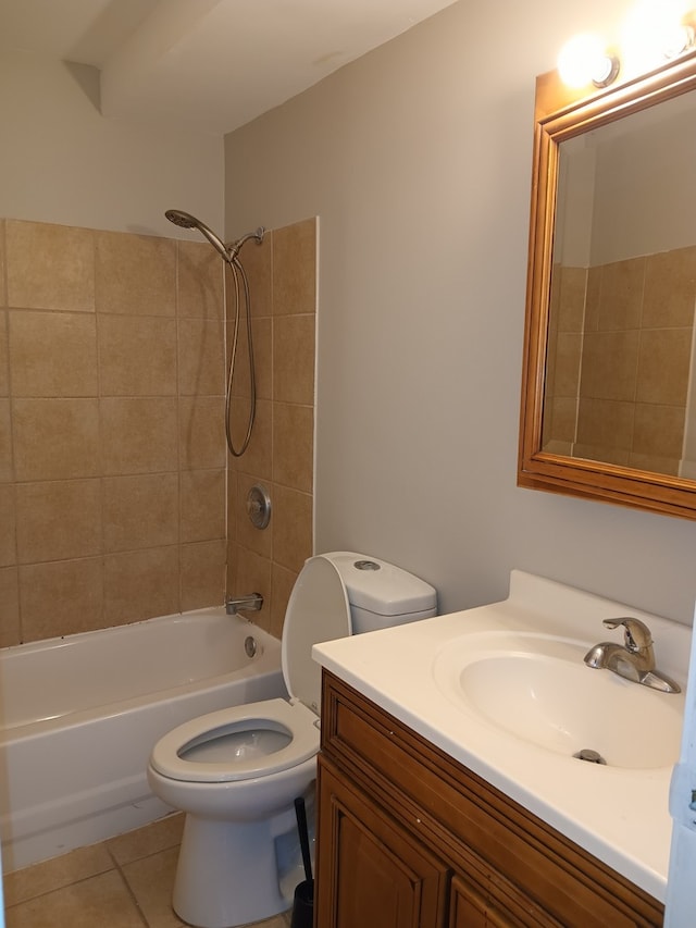 full bathroom featuring tile patterned floors, vanity, toilet, and tiled shower / bath