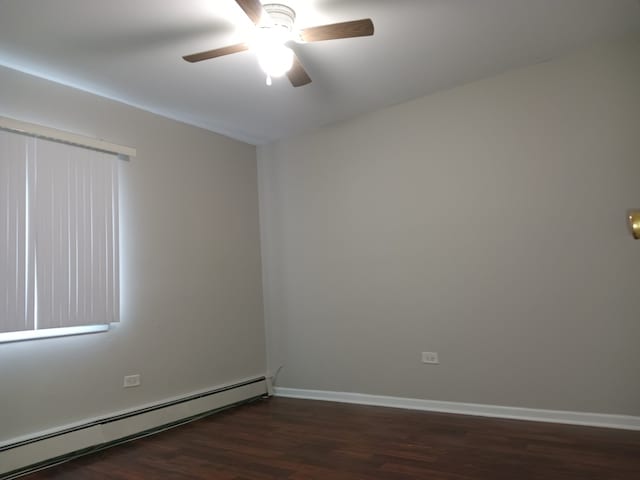 empty room featuring ceiling fan, dark hardwood / wood-style flooring, and a baseboard radiator