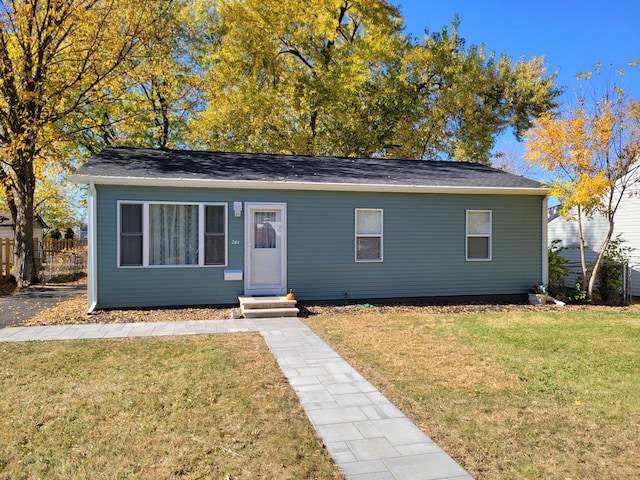 ranch-style home with a front lawn