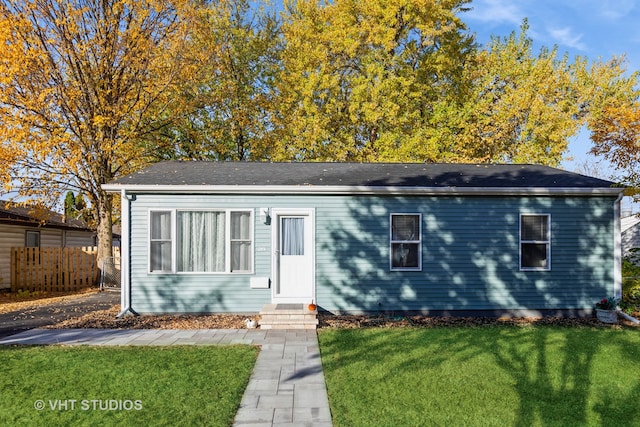 view of front of property with a front lawn