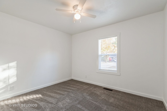 carpeted empty room with ceiling fan