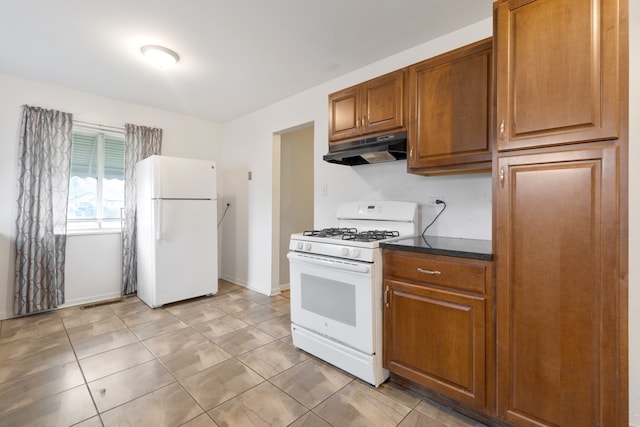 kitchen featuring white appliances and light tile patterned floors