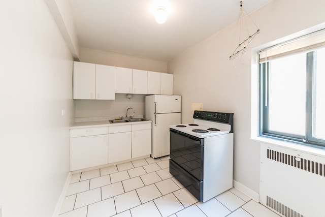 kitchen featuring white cabinetry, sink, white appliances, and radiator heating unit