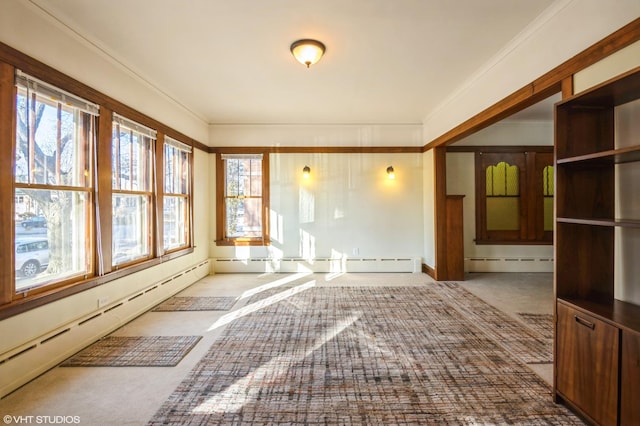 unfurnished sunroom with a baseboard radiator