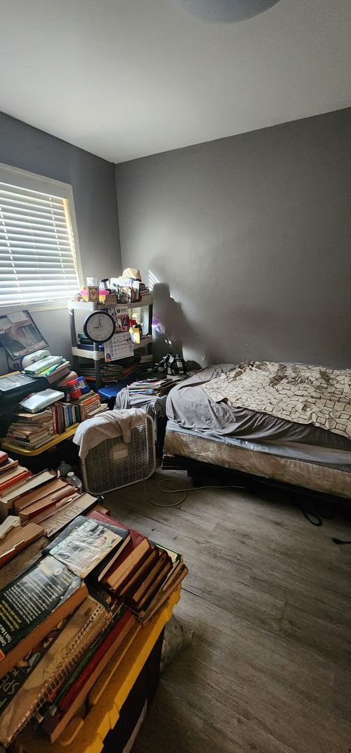 bedroom featuring dark hardwood / wood-style floors